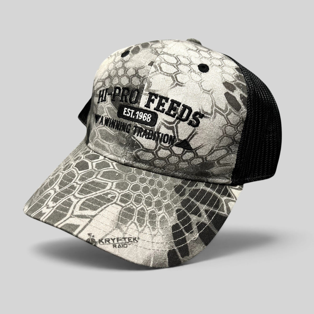 Raree Finds Hi-Pro Feeds trucker hat in gray and black Kryptek Raid camo with black embroidered logo and mesh back.