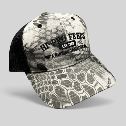 Raree Finds Hi-Pro Feeds trucker hat in gray and black Kryptek Raid camo with black mesh back and embroidered logo.