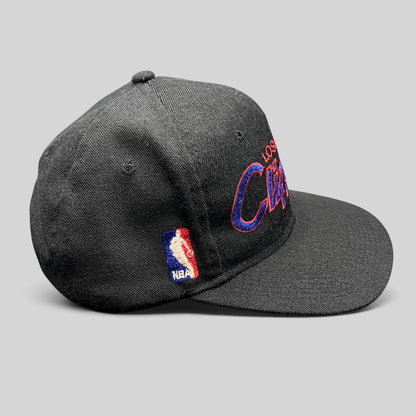 Raree Finds vintage Sports Specialties LA Clippers black snapback hat with red and blue script logo and NBA side patch