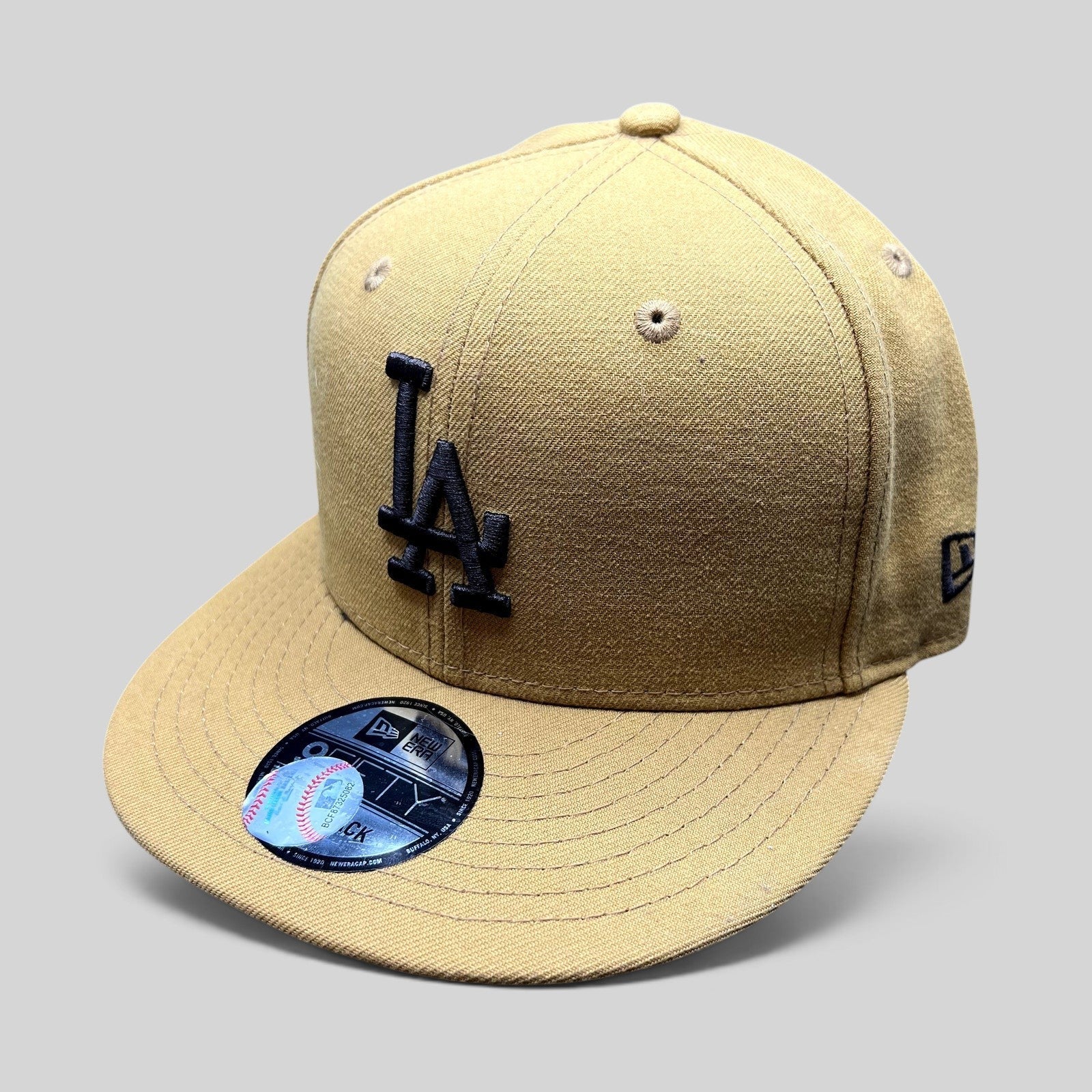 Raree Finds New Era LA Dodgers 9FIFTY snapback hat in tan with black LA embroidery and a structured flat brim.