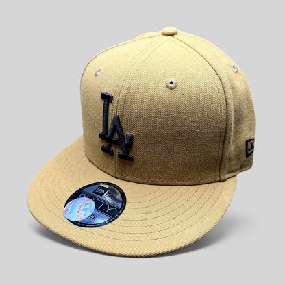 Raree Finds New Era LA Dodgers 9FIFTY snapback hat in tan with black LA embroidery and a structured flat brim.