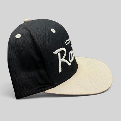 Raree Finds Reebok NFL Vintage Collection LA Raiders snapback hat with black crown, grey brim, and white embroidery.
