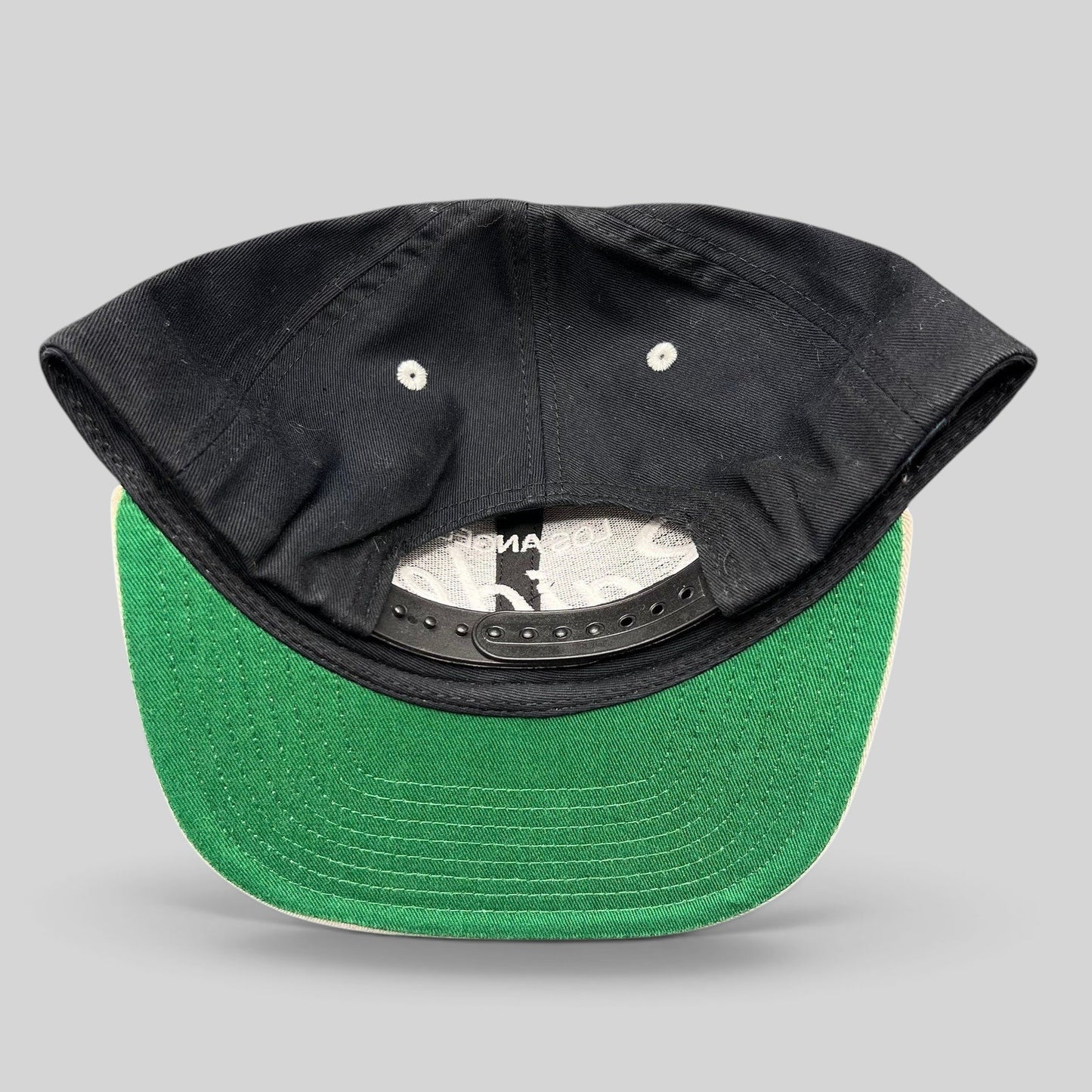 Raree Finds Reebok NFL Vintage Collection LA Raiders snapback hat showing the black crown and green undervisor