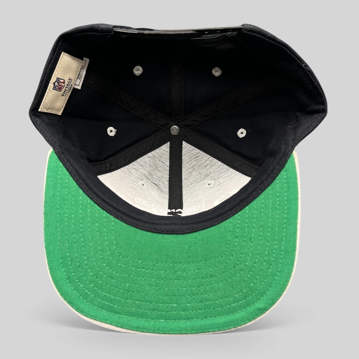Raree Finds Reebok NFL Vintage Collection LA Raiders snapback hat interior view showing green undervisor and tags