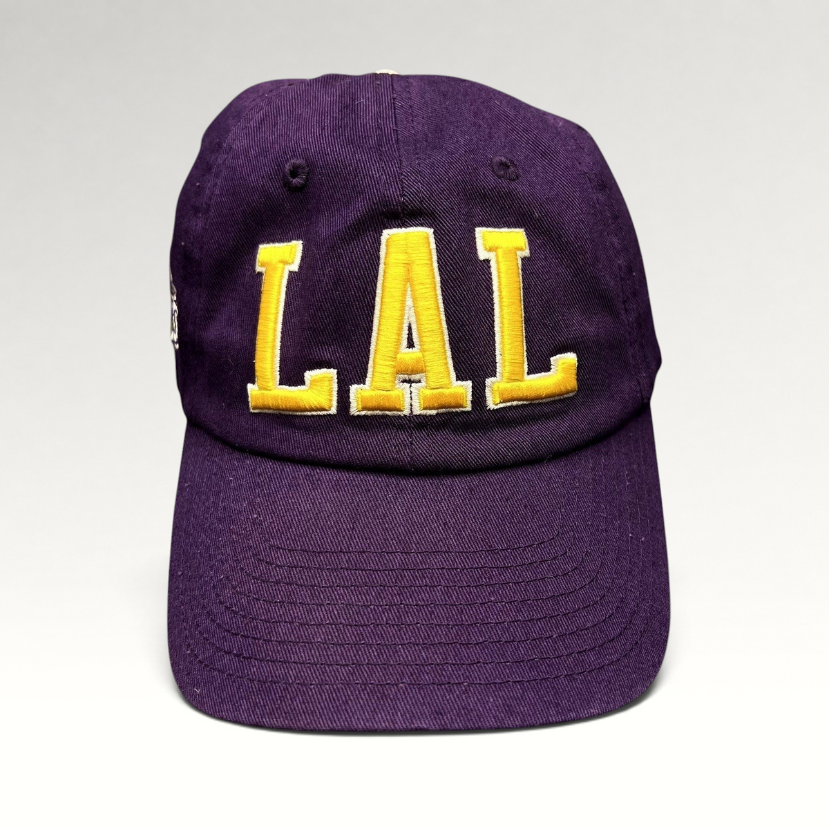 Raree Finds purple Los Angeles Lakers LAL strapback hat with yellow tackle twill embroidery on a cotton crown.