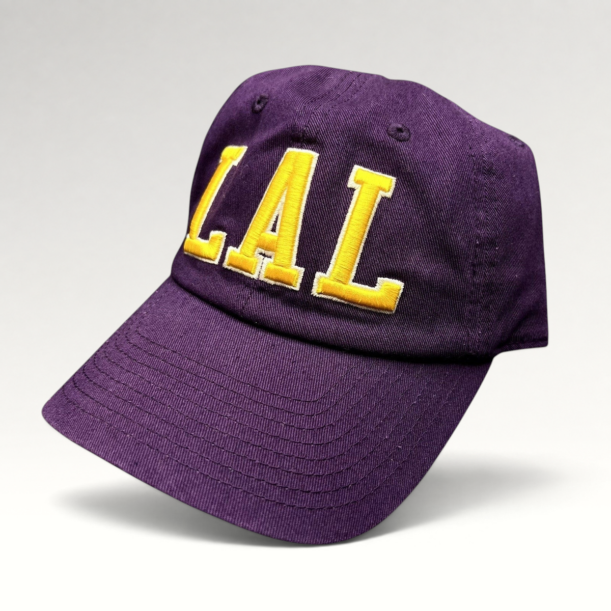 Raree Finds purple Los Angeles Lakers LAL strapback hat with yellow tackle twill embroidery on a cotton cap