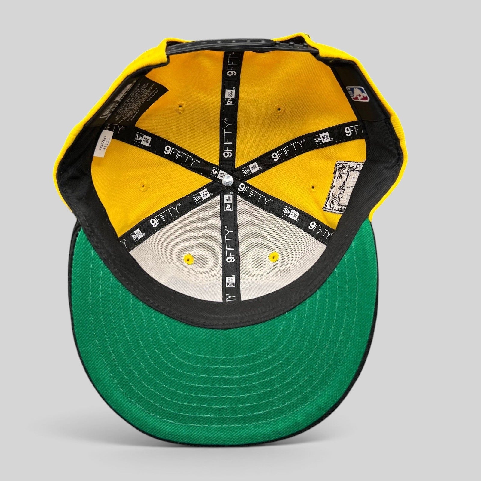 Raree Finds Los Angeles Lakers New Era 9FIFTY snapback interior showing gold crown, green undervisor, and branding