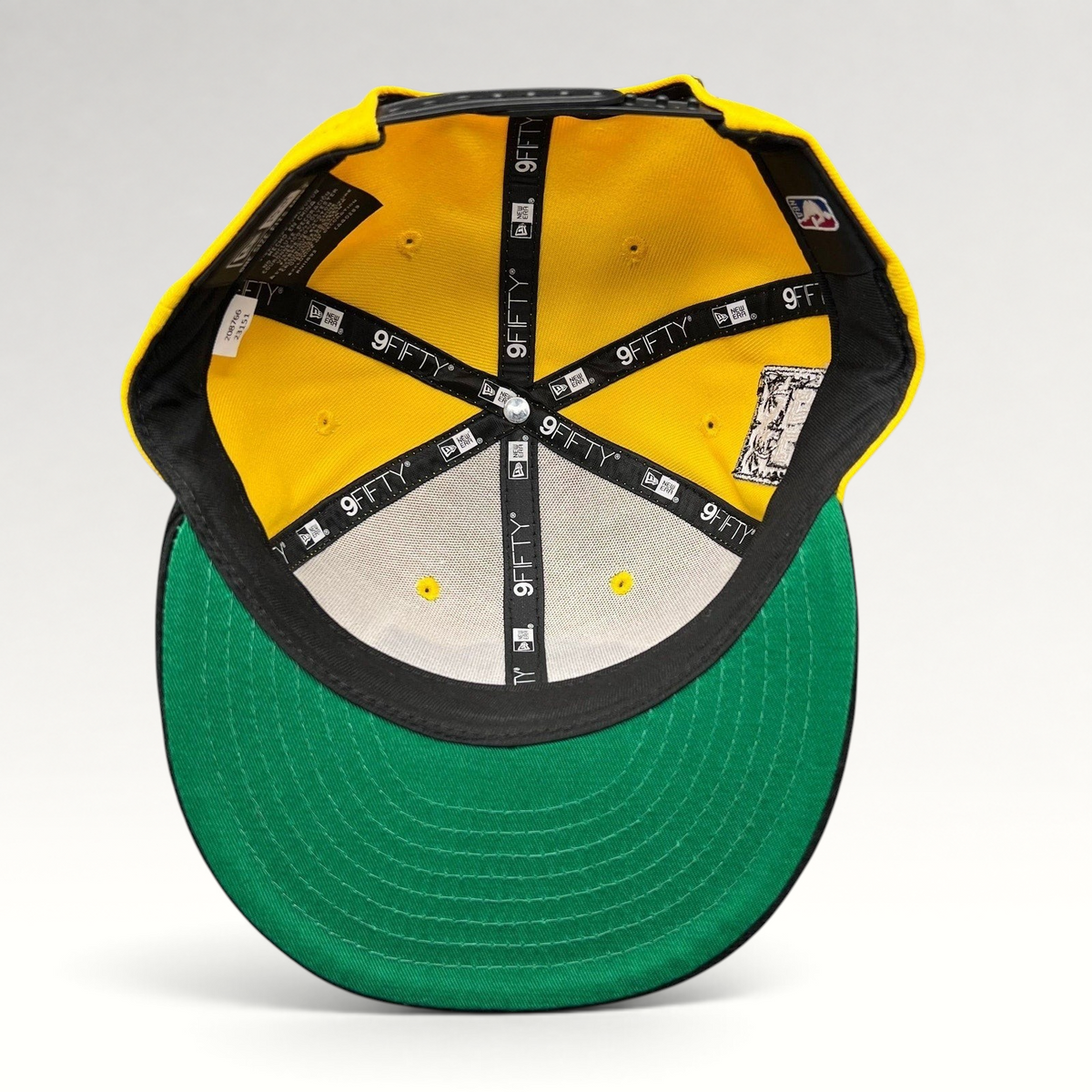 Raree Finds Los Angeles Lakers New Era 9FIFTY snapback interior showing gold crown, green undervisor, and branding