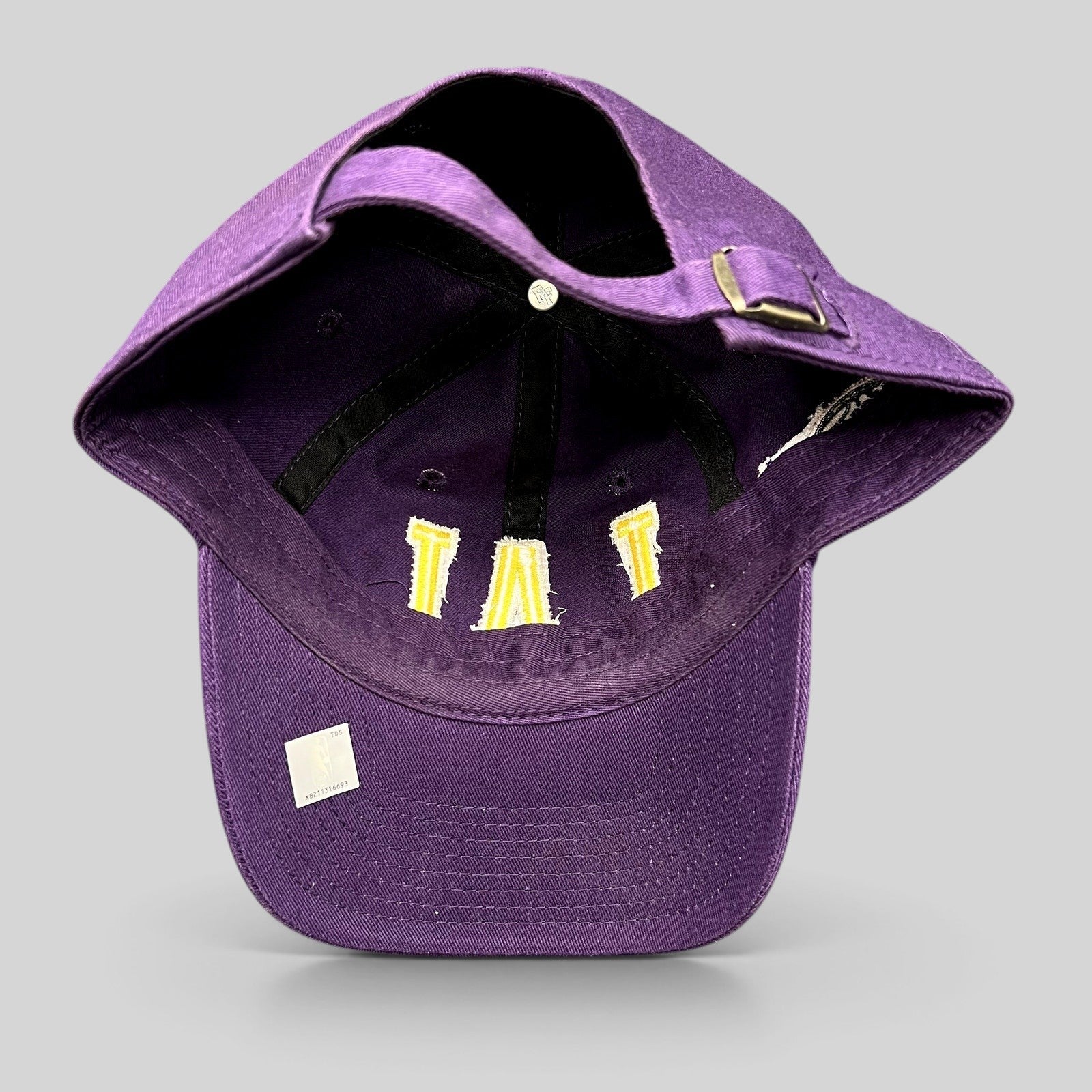 Raree Finds purple Los Angeles Lakers strapback hat showing the interior construction and LAL embroidery detail
