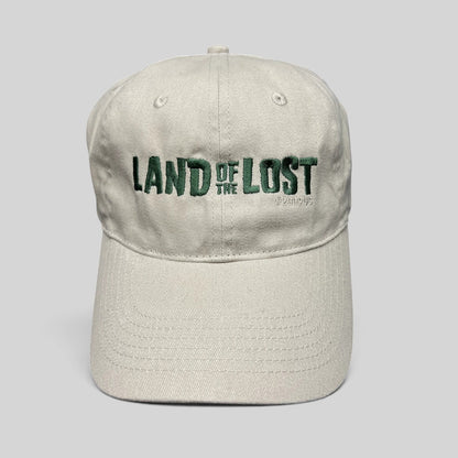 Raree Finds off-white cotton strapback hat with green Land of the Lost movie embroidery and curved brim