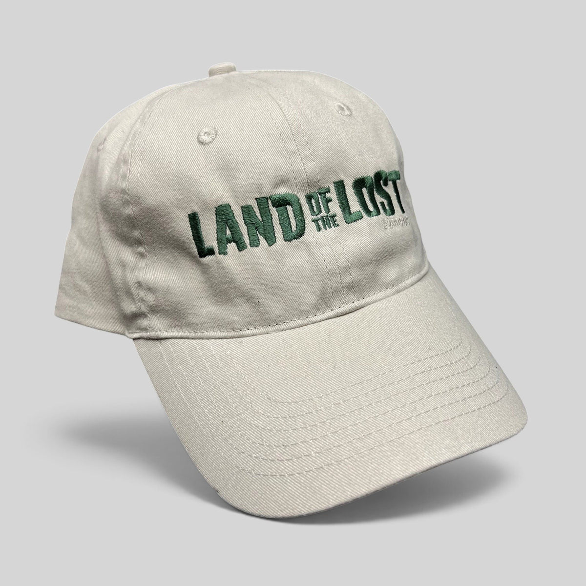 Raree Finds Land of the Lost 2009 movie promo strapback hat in off-white cotton with green embroidered lettering.