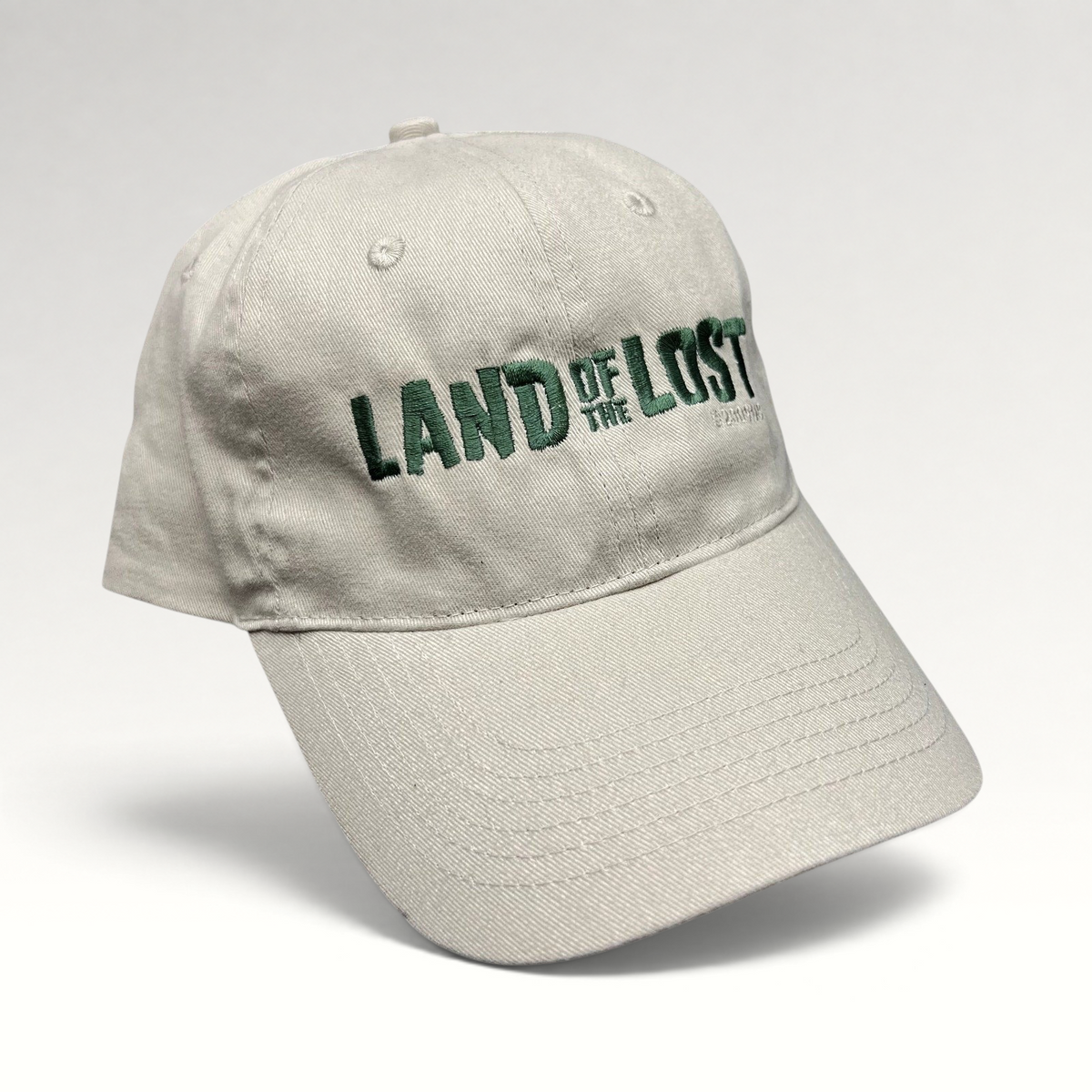 Raree Finds Land of the Lost 2009 movie promo strapback hat in off-white cotton with green embroidered lettering.