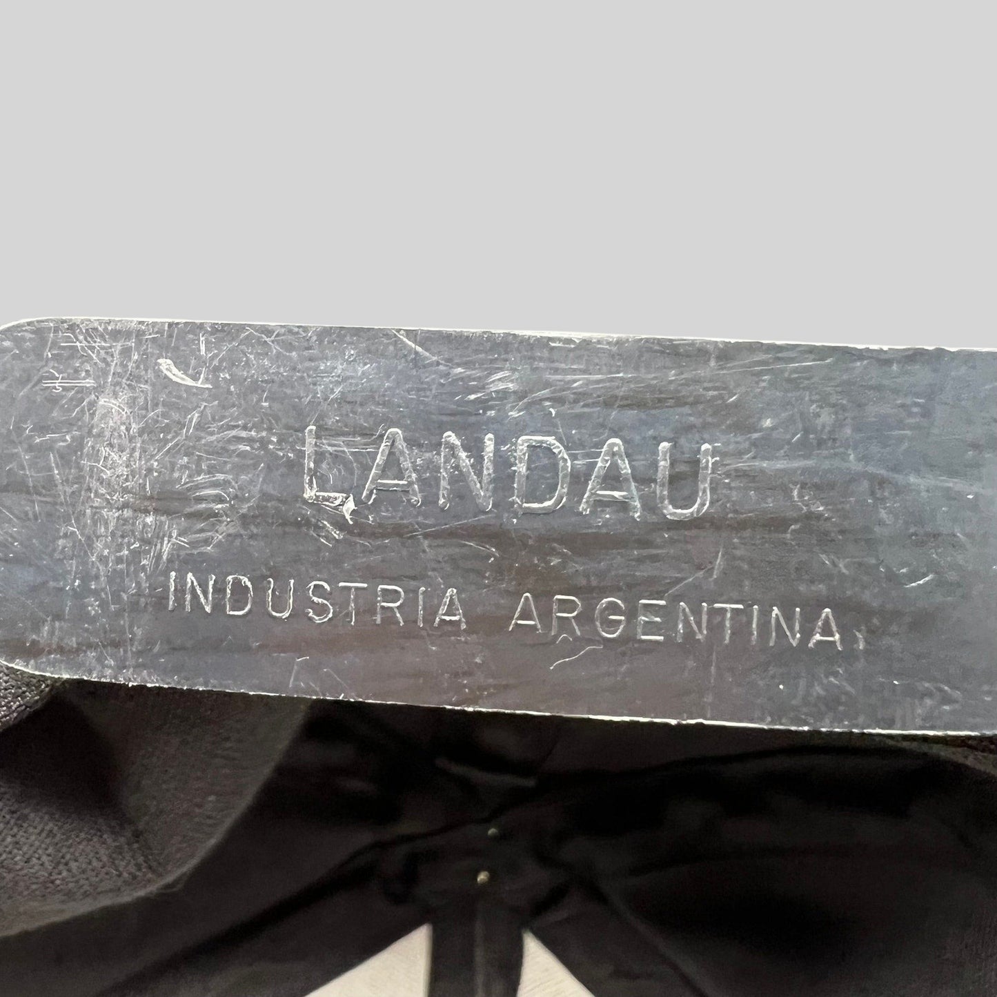 Raree Finds vintage hat interior label reading LANDAU INDUSTRIA ARGENTINA on a black cotton snapback