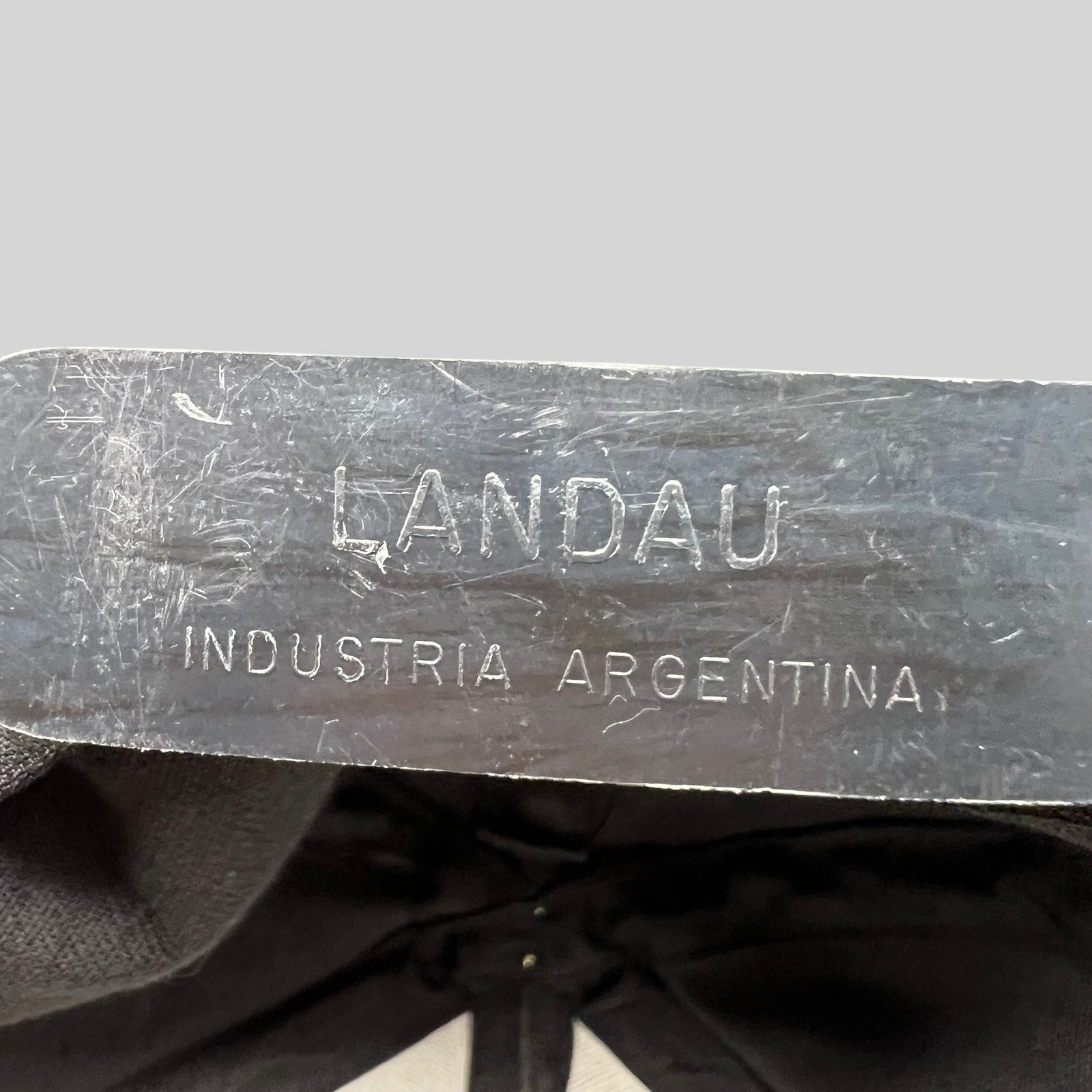 Raree Finds vintage hat interior label reading LANDAU INDUSTRIA ARGENTINA on a black cotton snapback