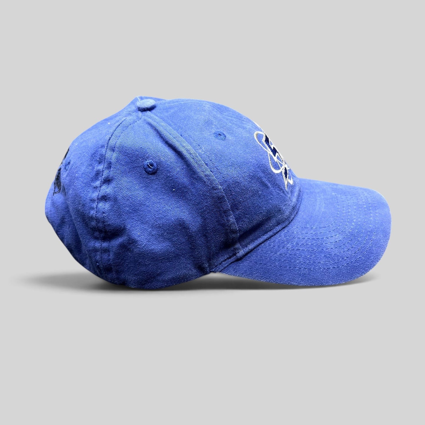 Raree Finds royal blue Las Vegas 51s MiLB strapback hat with embroidered atomic logo on a black background
