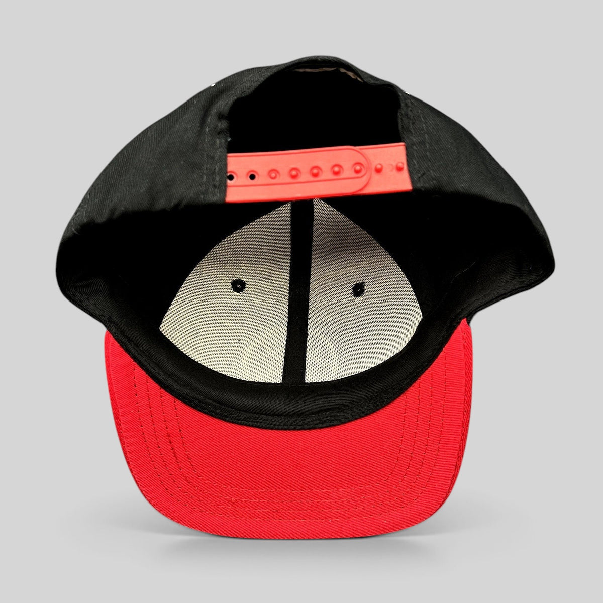 Raree Finds LawBreakers snapback hat in black and red with an adjustable plastic strap closure, rear view.
