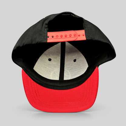 Raree Finds LawBreakers snapback hat in black and red with an adjustable plastic strap closure, rear view.