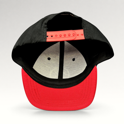 Raree Finds LawBreakers snapback hat in black and red with an adjustable plastic strap closure, rear view.
