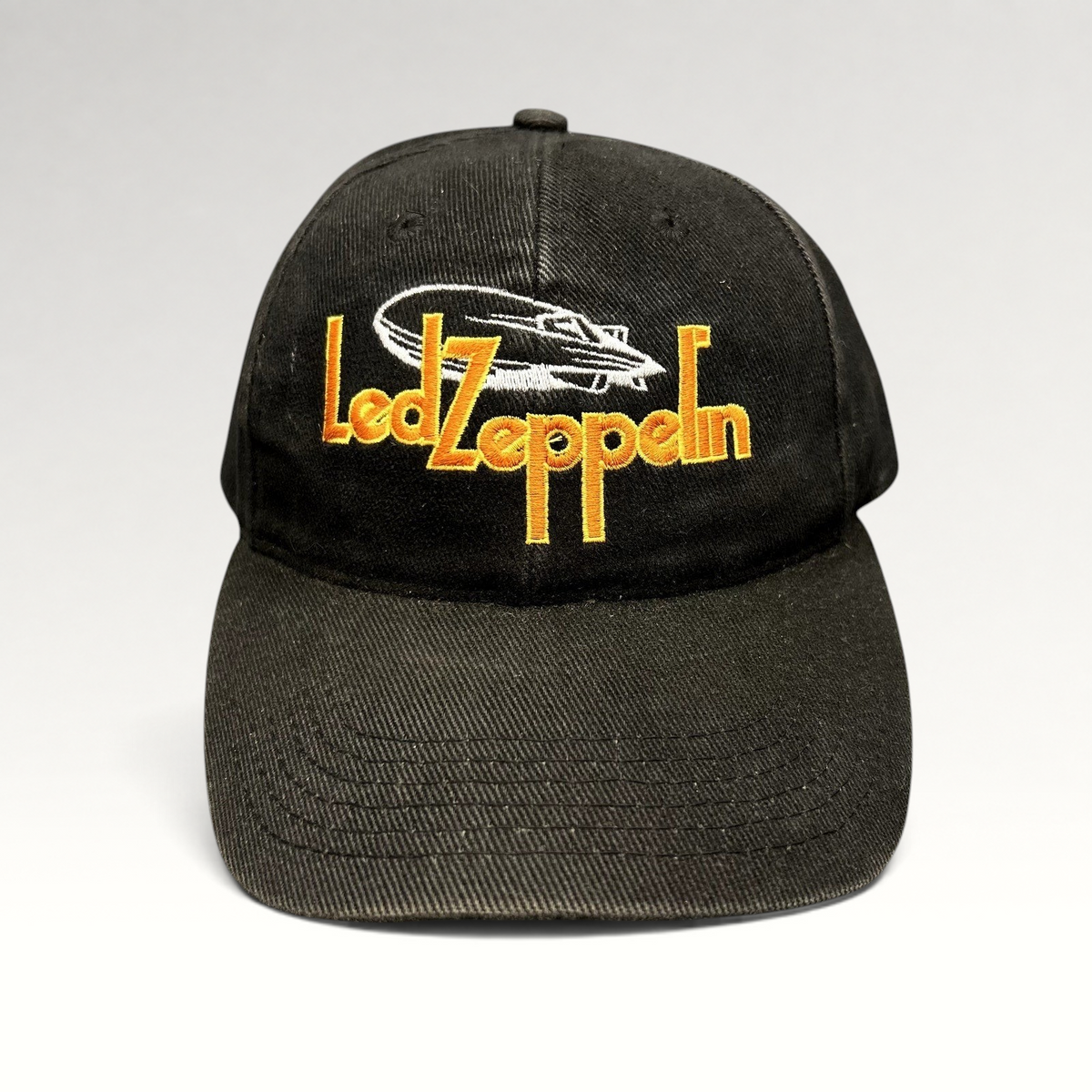 Raree Finds black cotton strapback hat featuring an embroidered yellow Led Zeppelin logo and white airship graphic.