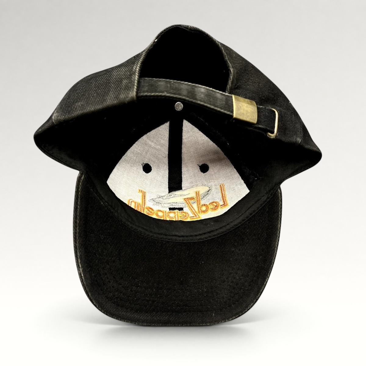 Raree Finds black cotton Led Zeppelin strapback hat with brass buckle and embroidered airship logo on the interior