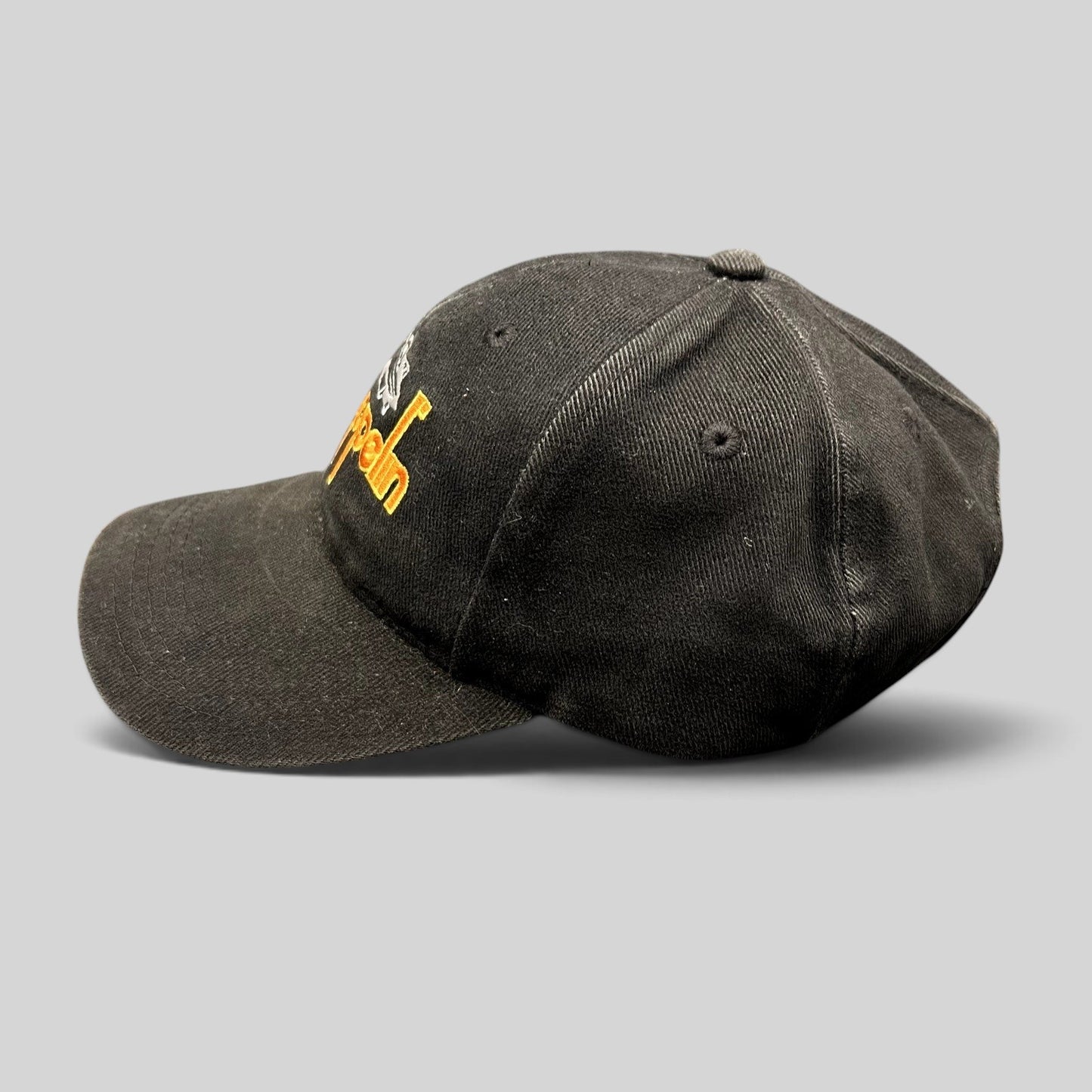 Raree Finds black cotton Led Zeppelin strapback hat with embroidered airship logo and brass buckle side profile view