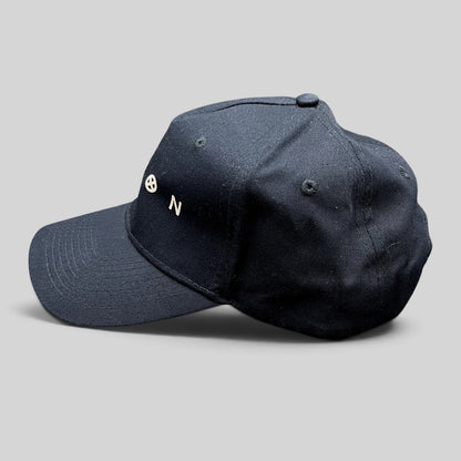 Raree Finds black Legion Marvel FX TV series strapback hat with white logo embroidery on a side profile view.