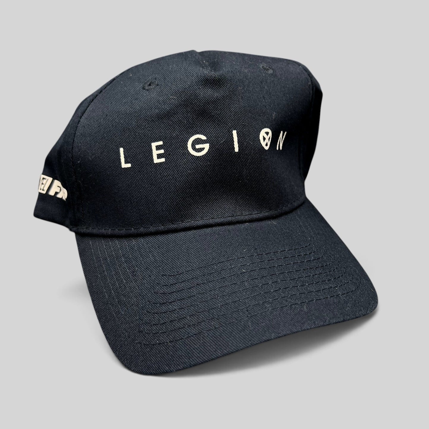 Raree Finds black Legion Marvel FX strapback hat with white logo embroidery on the front and side panel.