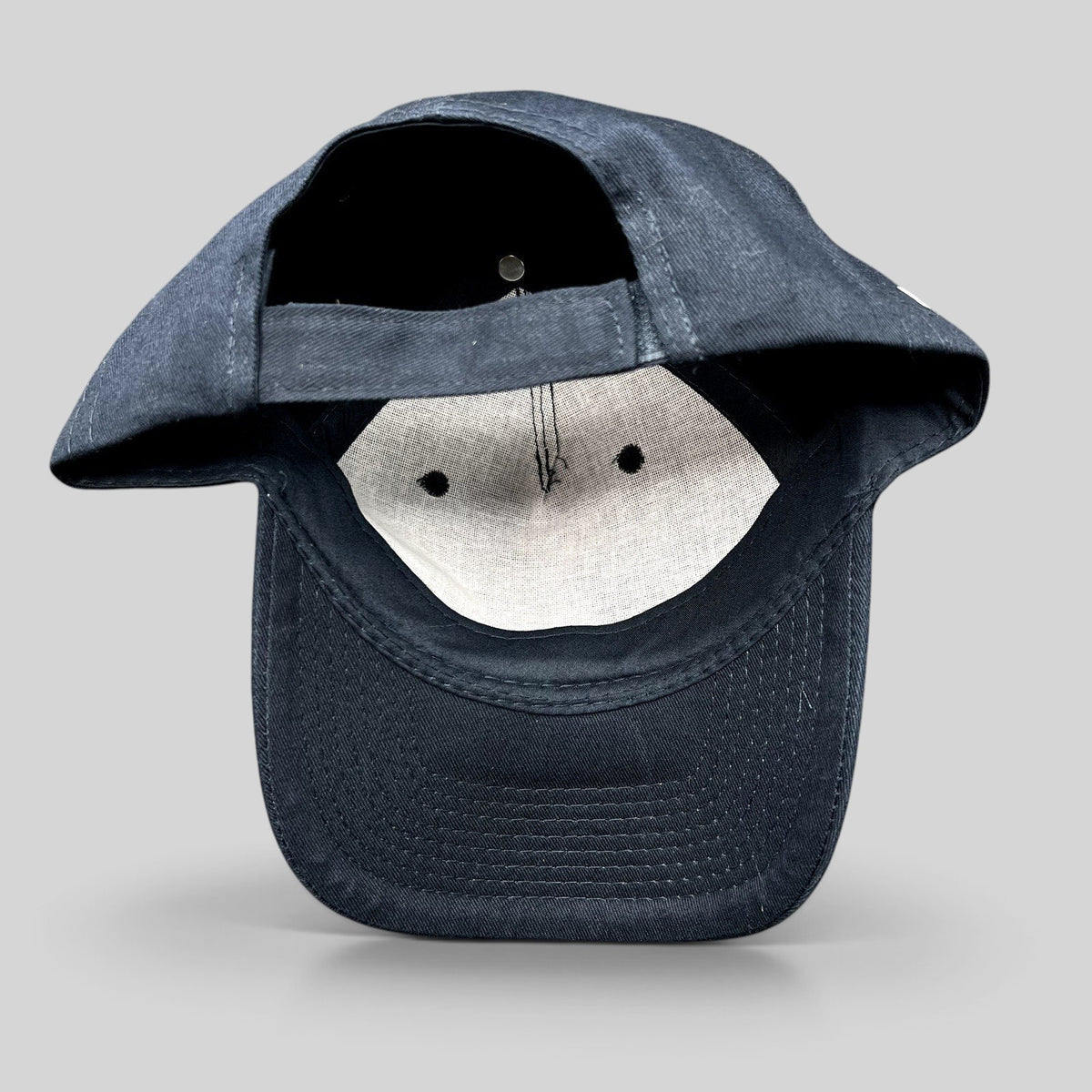 Raree Finds black Legion Marvel FX strapback hat showing the interior lining and adjustable strap closure