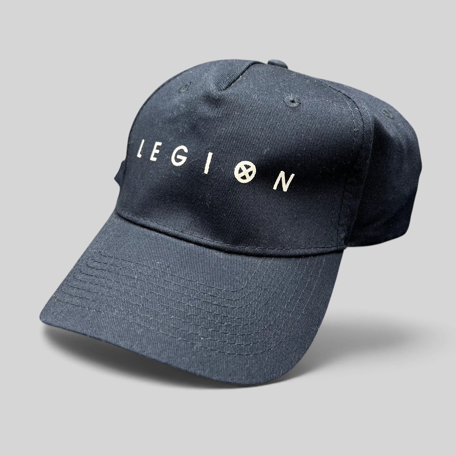 Raree Finds black Legion Marvel FX TV series strapback hat with white logo embroidery and adjustable rear strap