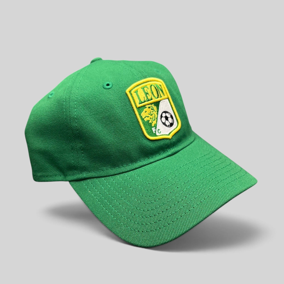 Raree Finds green LEON FC soccer crest strapback hat with embroidered shield logo and pre-curved brim