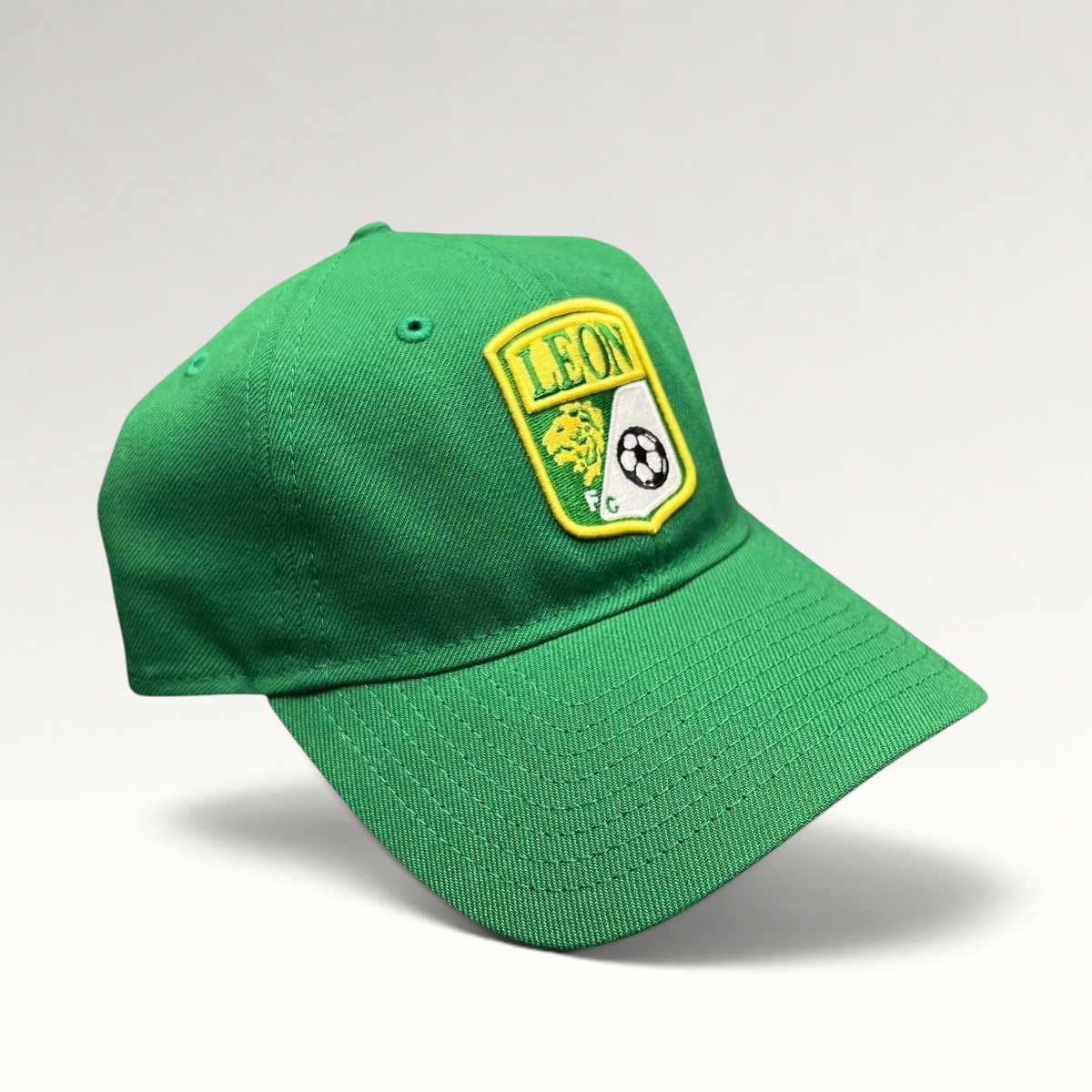 Raree Finds green LEON FC soccer crest strapback hat with embroidered shield logo and pre-curved brim