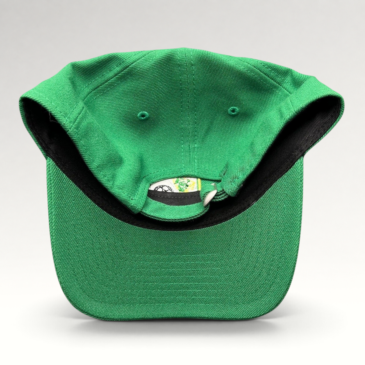 Raree Finds LEON FC green New Era 9TWENTY strapback hat showing the adjustable fabric strap and interior details