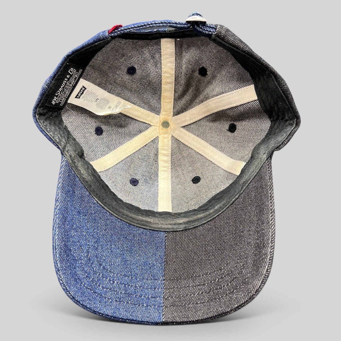 Raree Finds Levi’s two-tone black and indigo denim strapback cap interior showing branded labels and six-panel lining