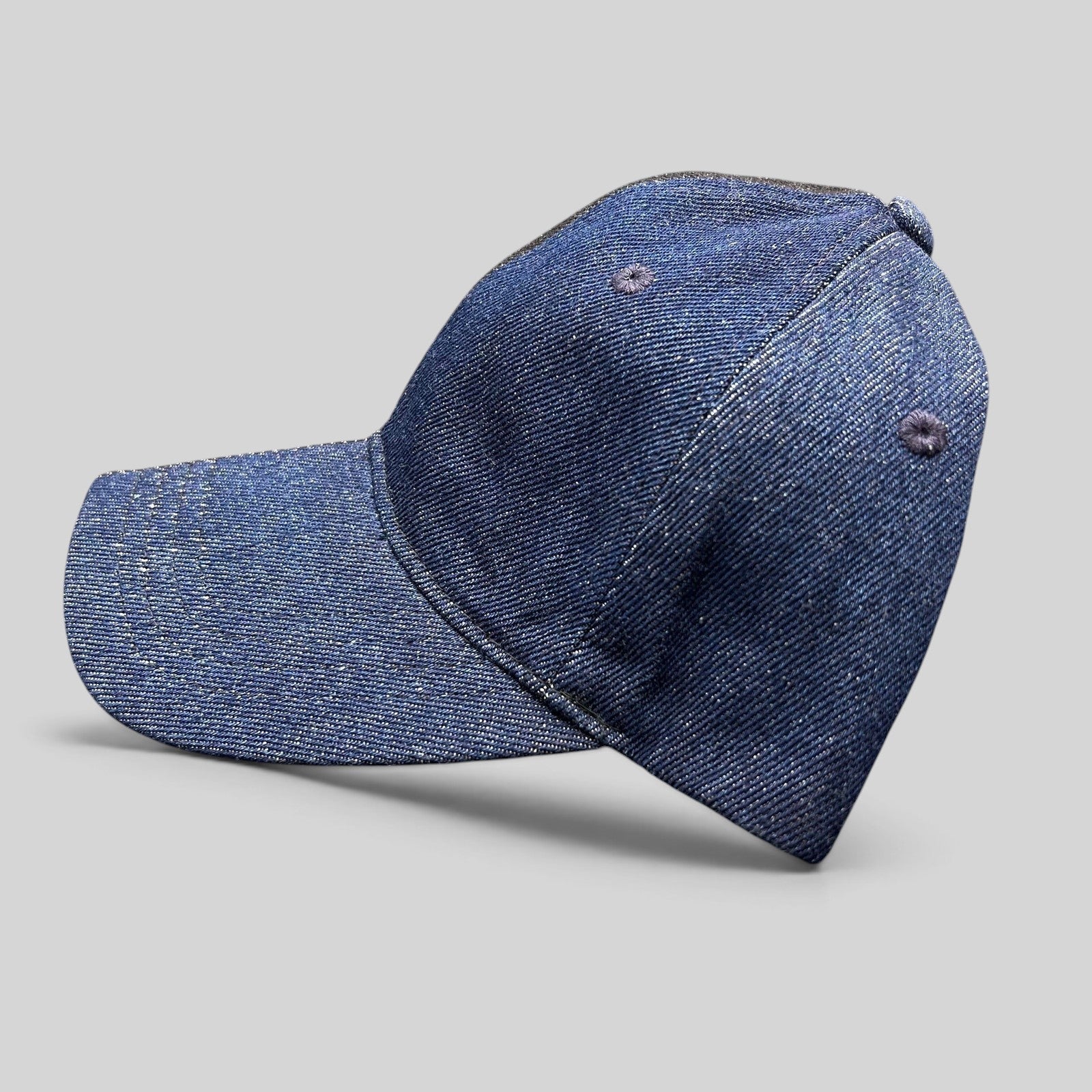 Raree Finds Levi’s two-tone black and indigo denim strapback cap with a curved brim and six-panel construction.