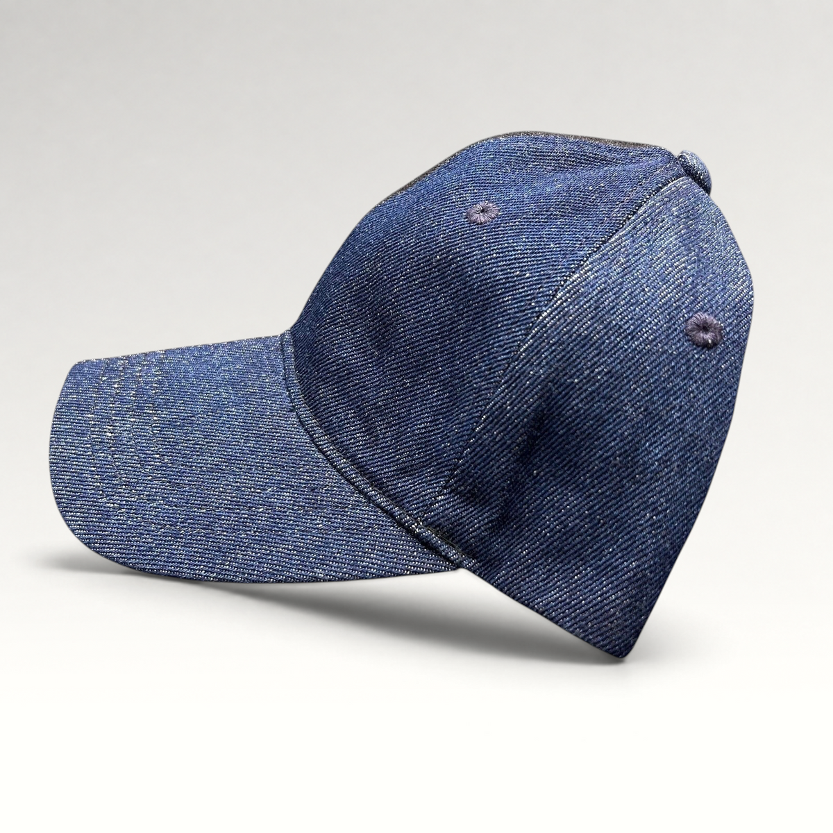 Raree Finds Levi’s two-tone black and indigo denim strapback cap with a curved brim and six-panel construction.