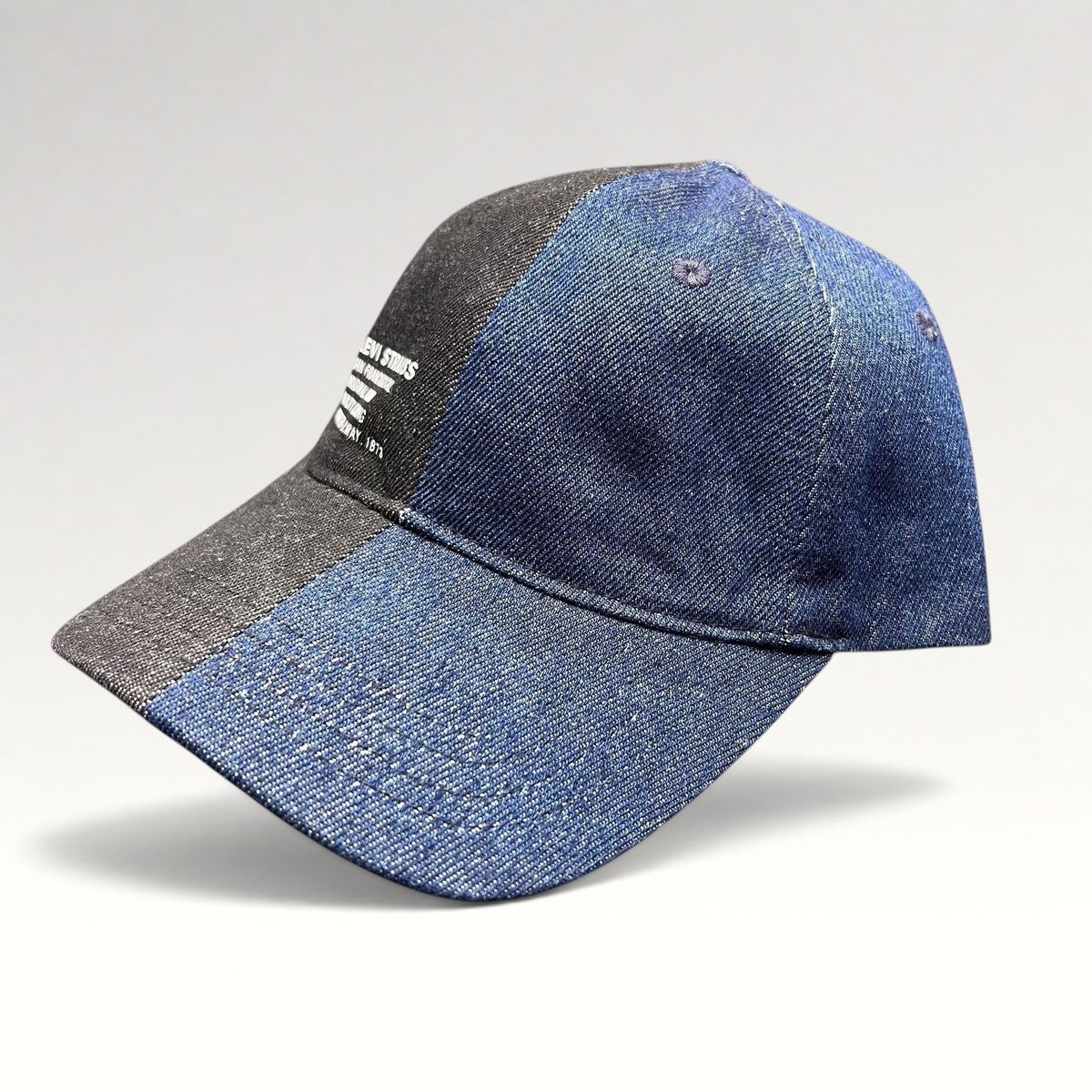 Raree Finds Levi’s two-tone black and indigo denim strapback cap with vintage San Francisco branding on the front.