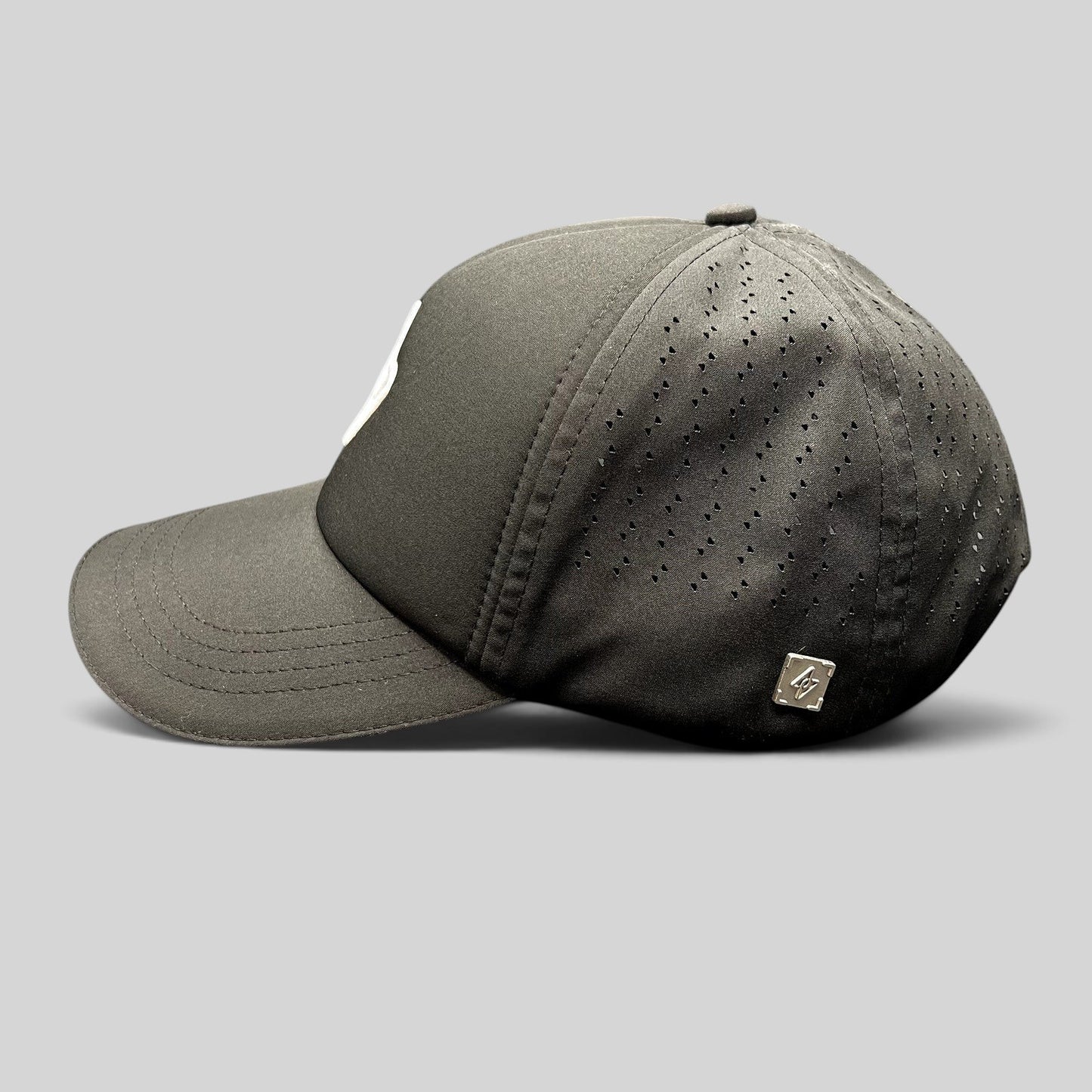 Raree Finds LGCY black performance strapback hat with laser-perforated side panels and curved brim