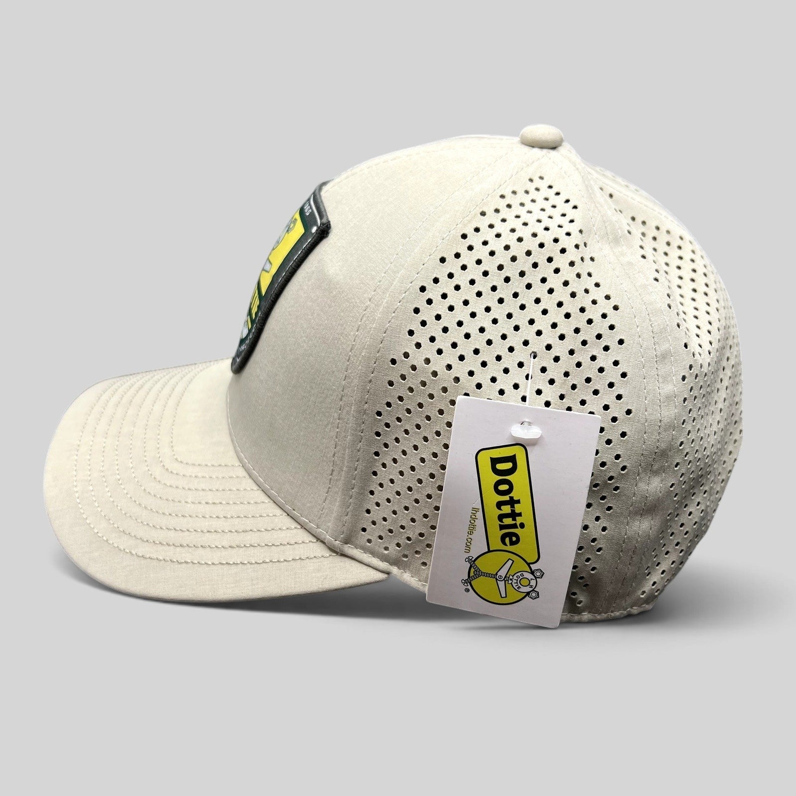 Raree Finds LH Dottie Company tan snapback hat with perforated panels and embroidered shield patch logo