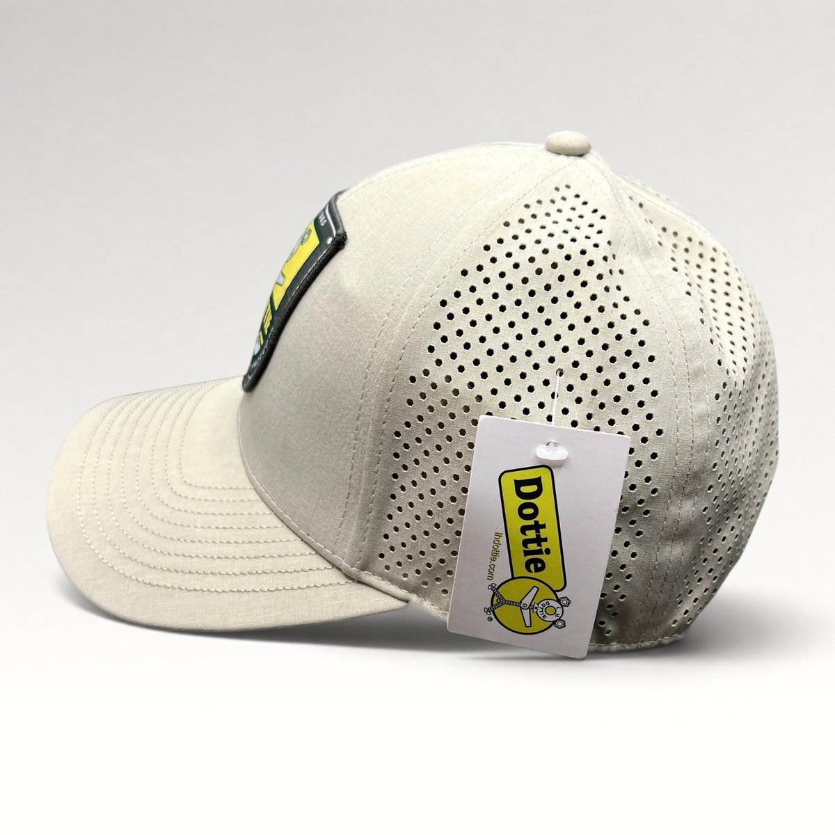 Raree Finds LH Dottie Company tan snapback hat with perforated panels and embroidered shield patch logo