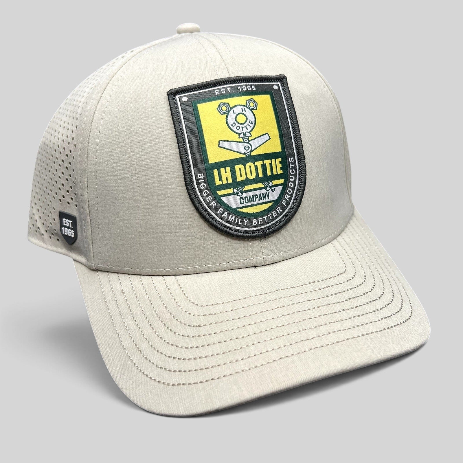 Raree Finds LH Dottie Company tan snapback hat with embroidered shield patch and perforated side panels