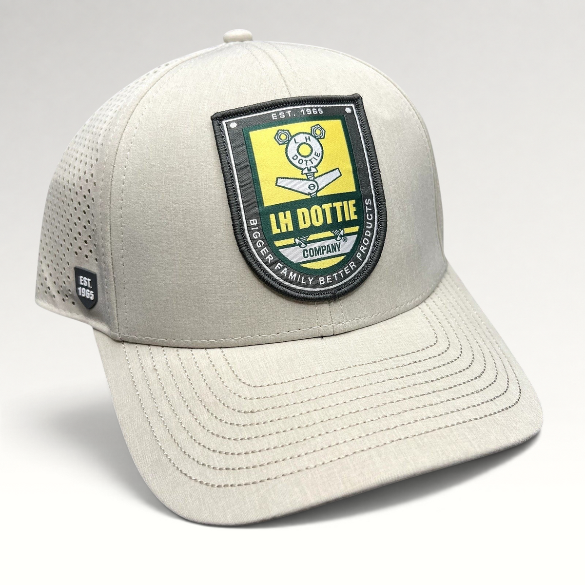 Raree Finds LH Dottie Company tan snapback hat with embroidered shield patch and perforated side panels
