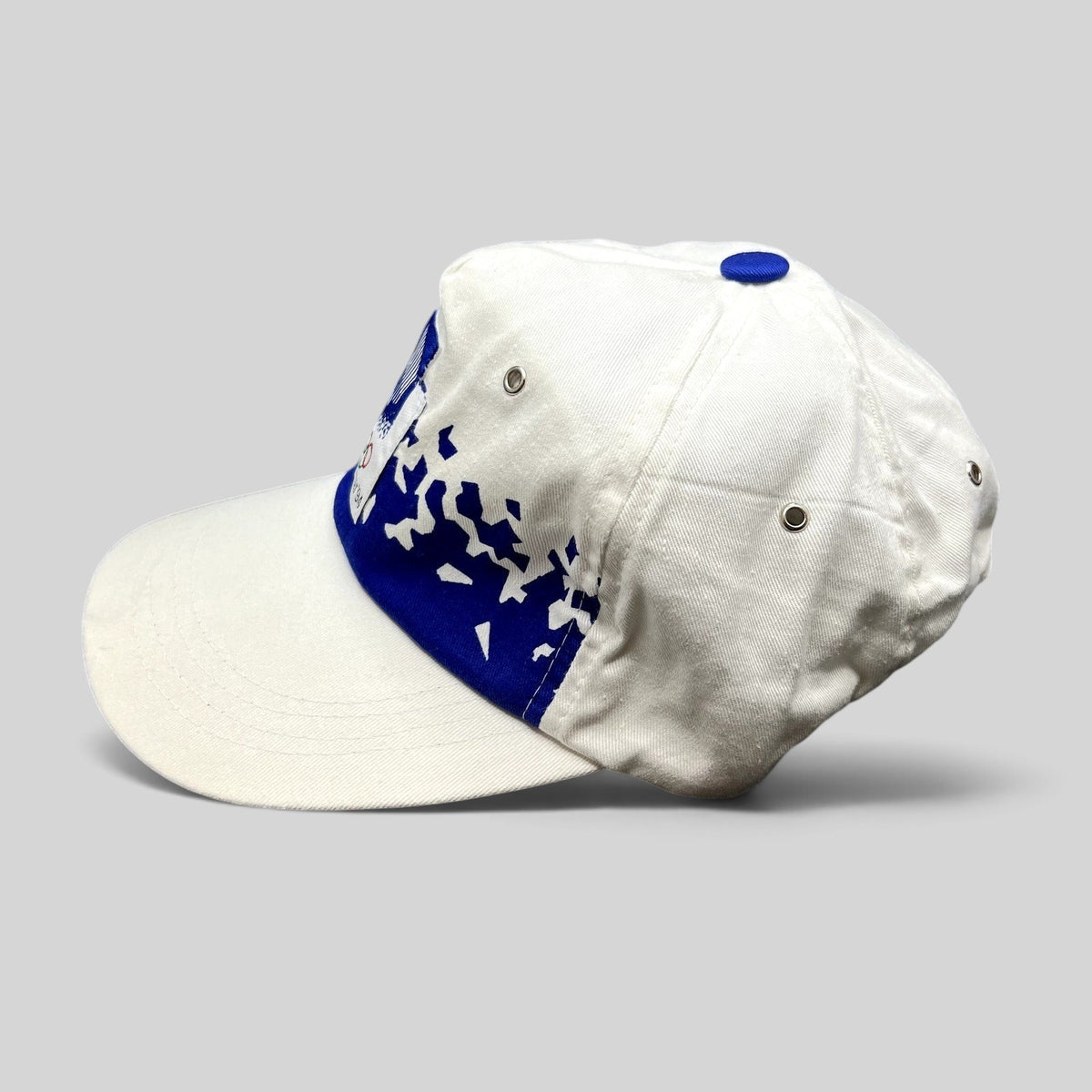 Raree Finds vintage 1994 Lillehammer Winter Olympics flex-back hat with white crown, blue brim, and Nordic graphics.