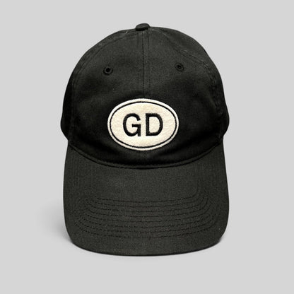 Raree Finds black cotton strapback hat by Liquid Blue featuring a white oval GD logo patch on the front