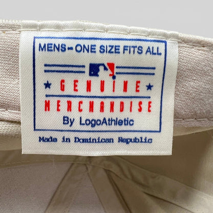 Raree Finds vintage Logo Athletic hat interior tag showing MLB genuine merchandise branding on khaki cotton fabric