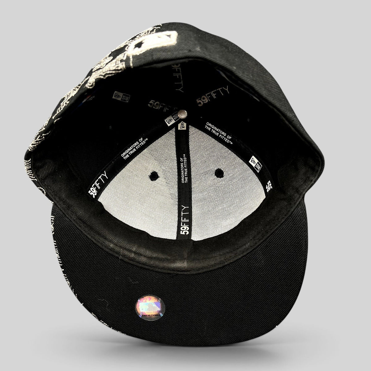 Raree Finds black New Era 59FIFTY Los Angeles Angels fitted cap interior showing branded taping and flat brim