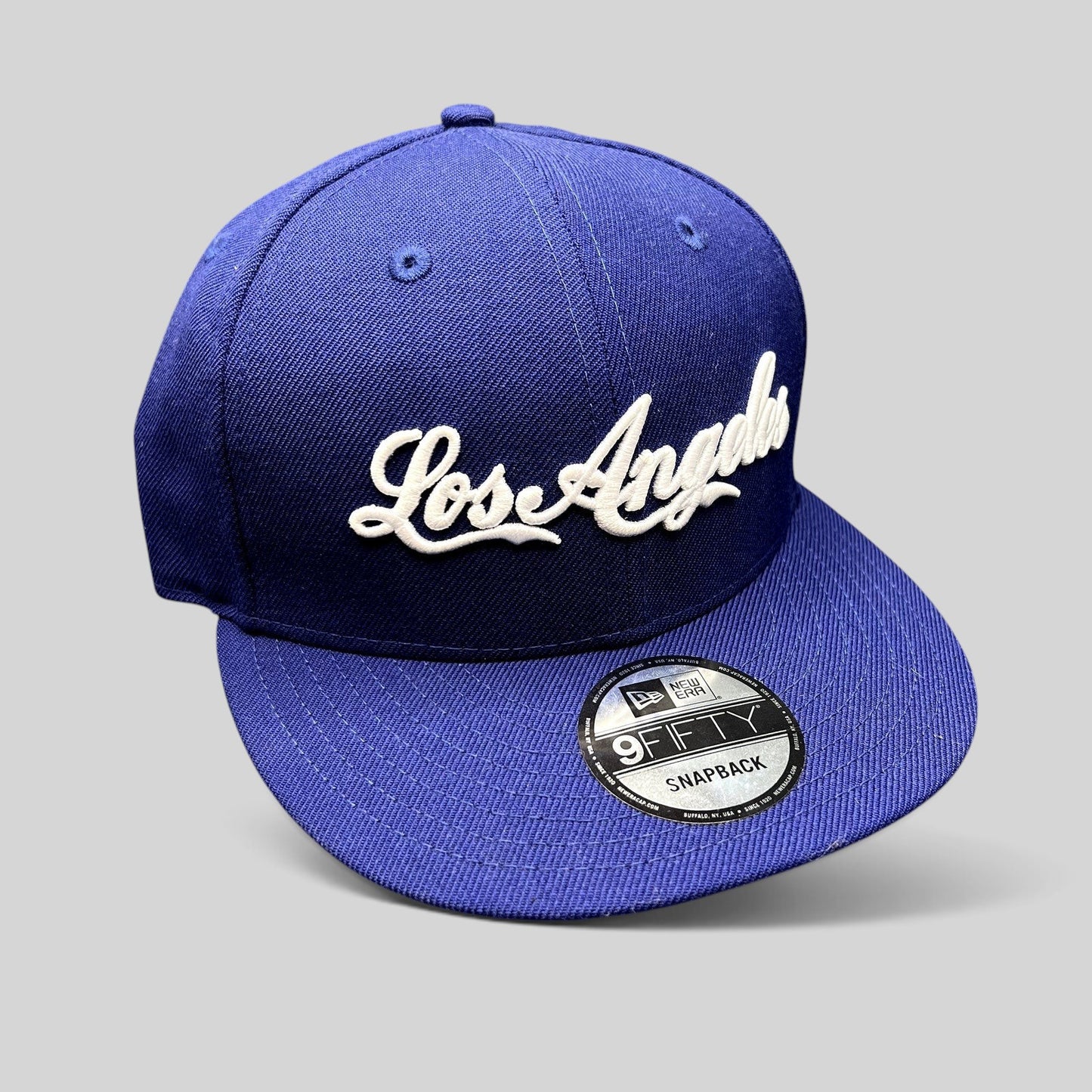 Raree Finds Los Angeles Dodgers royal blue New Era 9FIFTY snapback hat with white raised script logo and flat visor