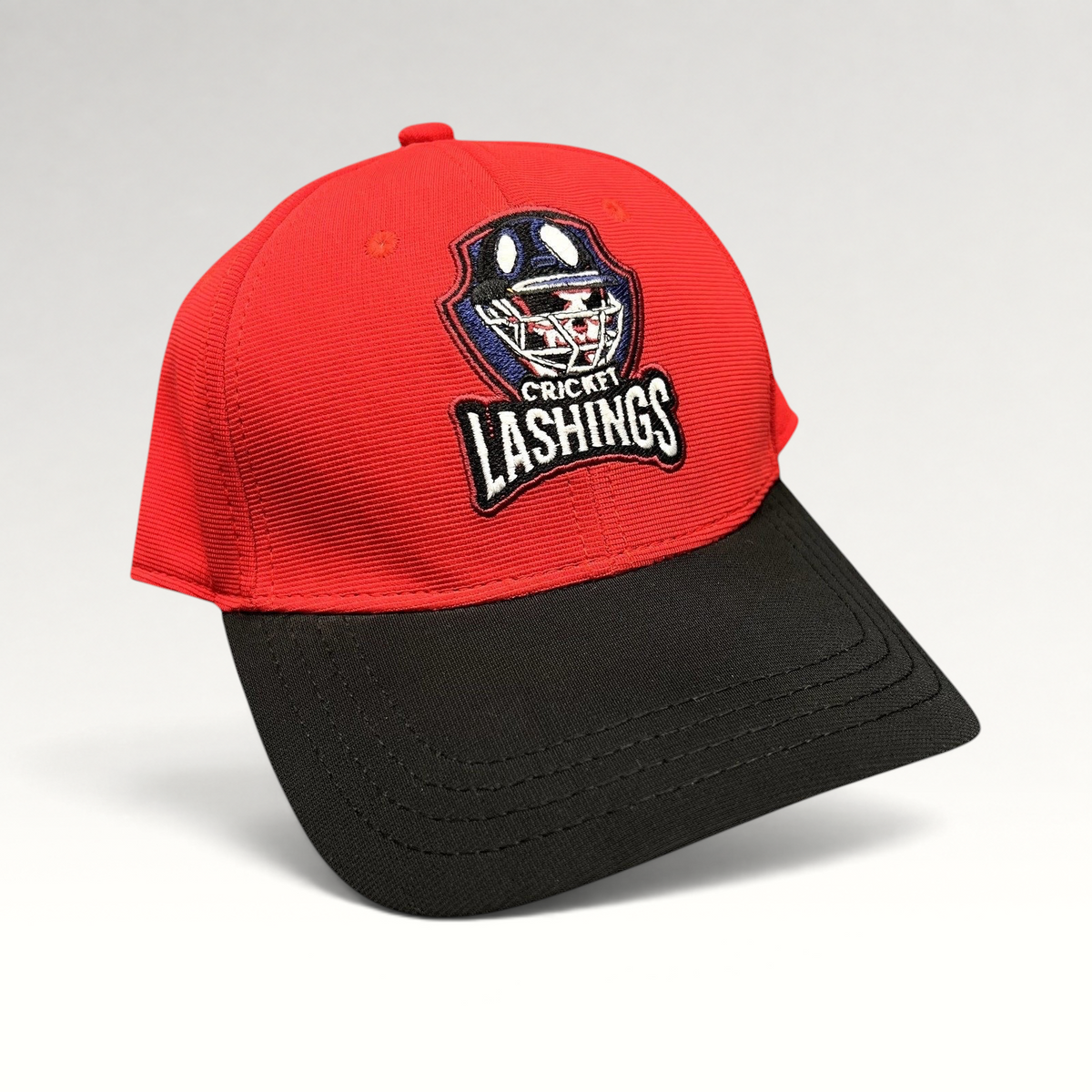 Raree Finds Los Angeles Lashings cricket team fitted cap with a red crown, black visor, and embroidered team crest.