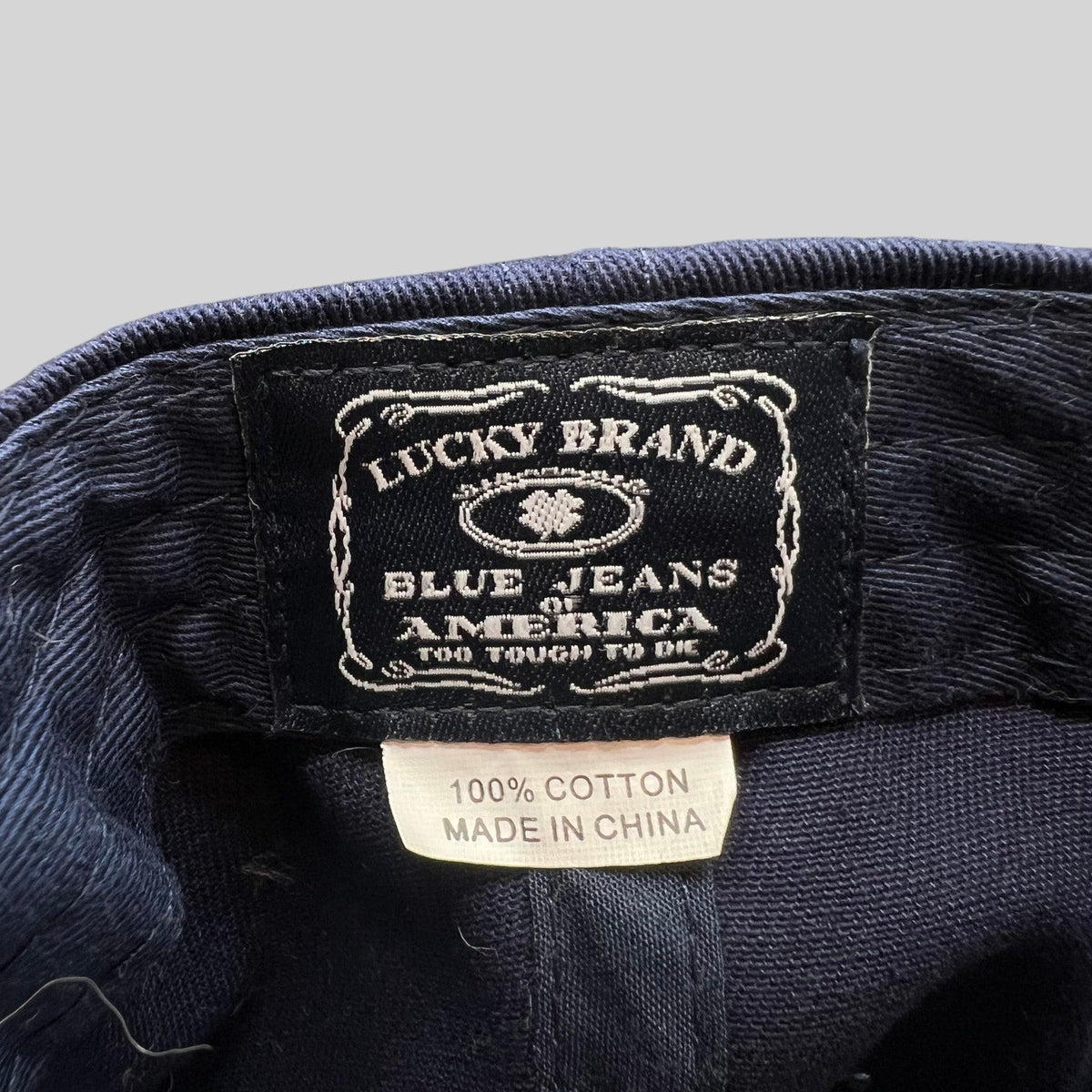 Raree Finds Lucky Brand navy cotton twill snapback cap interior label with vintage logo embroidery