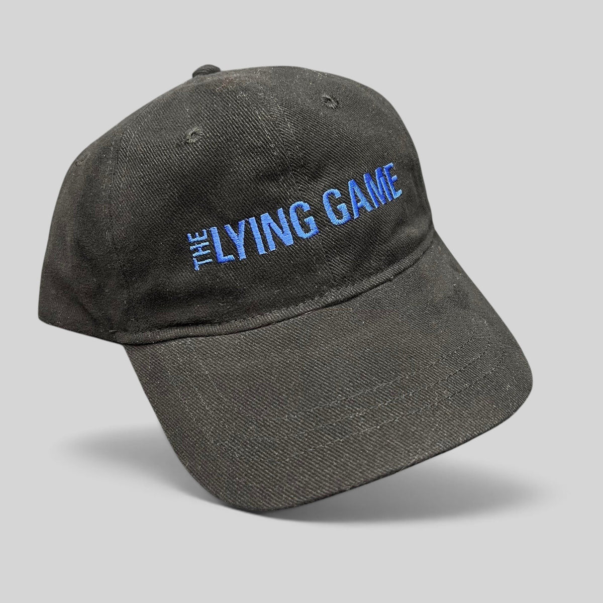 Raree Finds black cotton strapback hat with blue The Lying Game pilot crew embroidery
