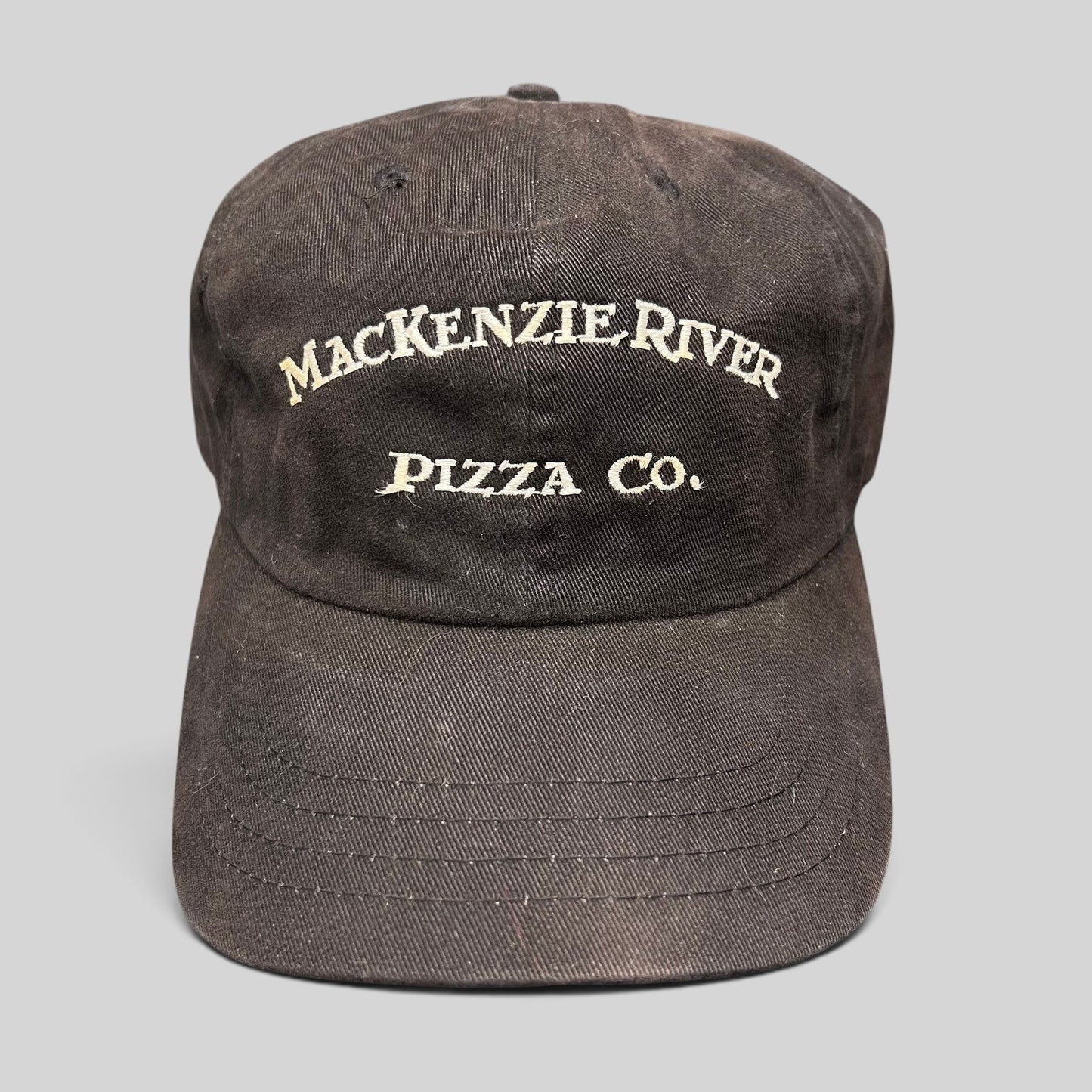 Raree Finds vintage dark brown Mackenzie River Pizza Co. strapback hat with white embroidered arched lettering